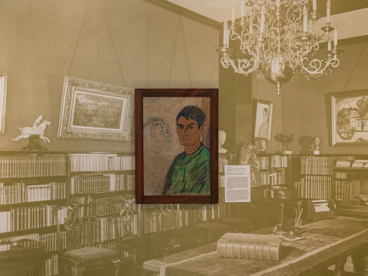 Framed portrait painting in front of a large historical interior photograph with bookshelves and a chandelier.