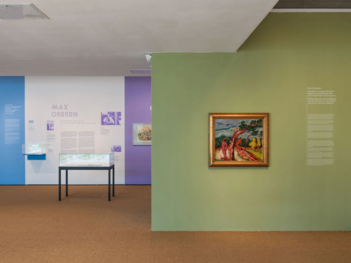 Exhibition room with a green wall and framed painting, with purple panels and a Max Osborn section behind it.