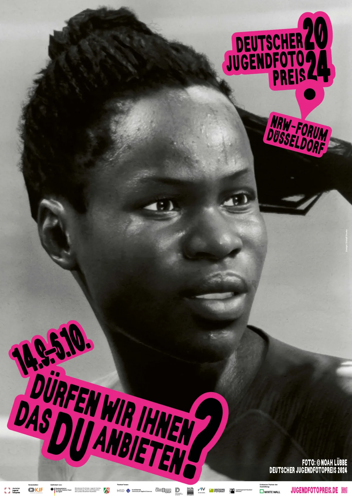 Black and white portrait with hair worn up and a sideways gaze, overlaid with pink German Youth Photography Award text stickers.