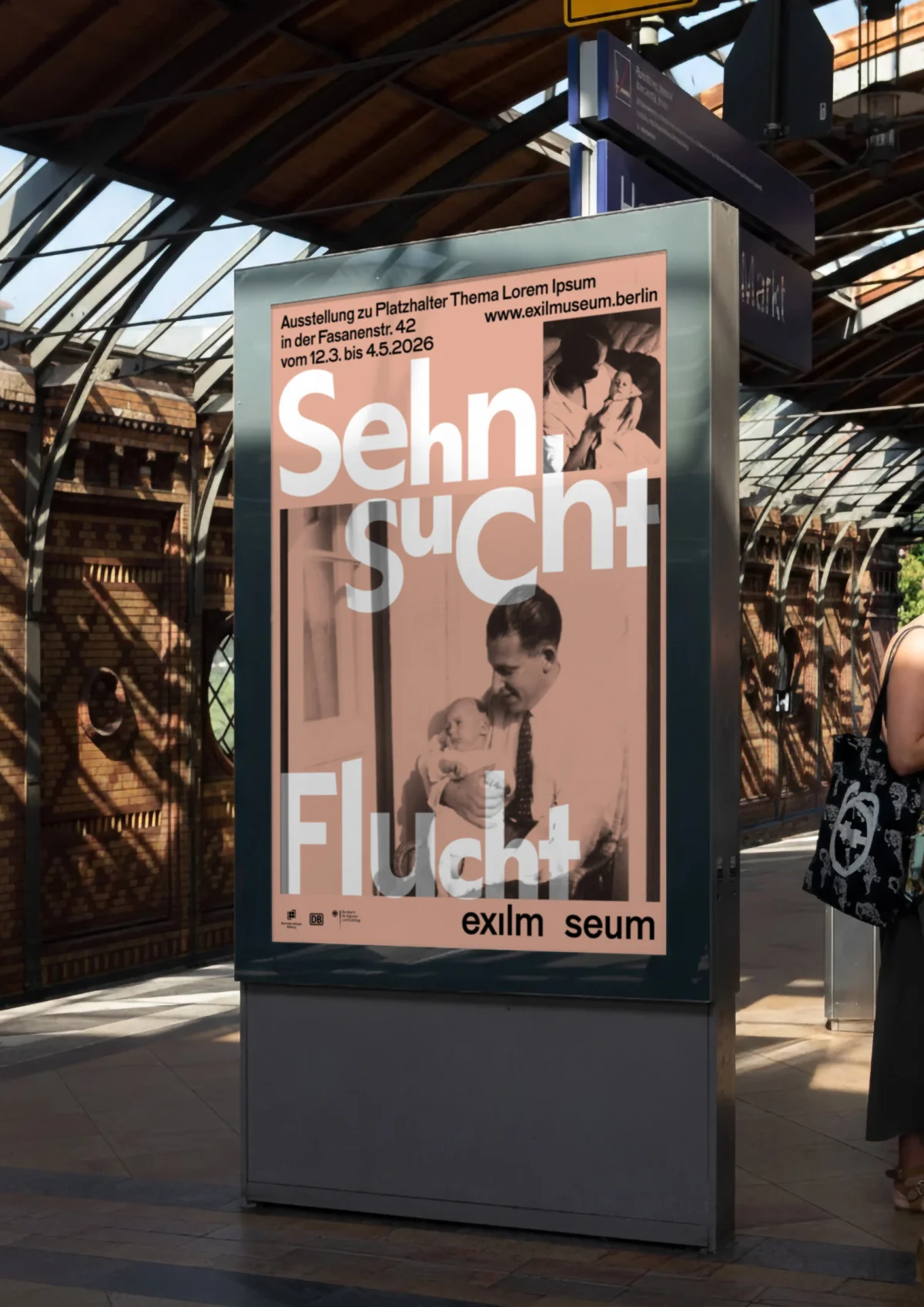 Advertising display at a station with a pink Exilmuseum poster, historical portraits and large white “Sehnsucht” and “Flucht” lettering.