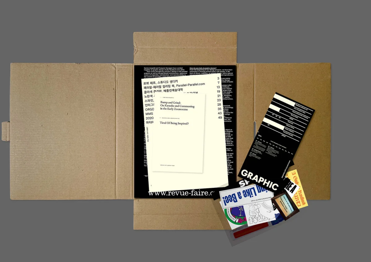 Open GRAPHIC box with a Korean contents sheet and smaller printed items placed to its right.