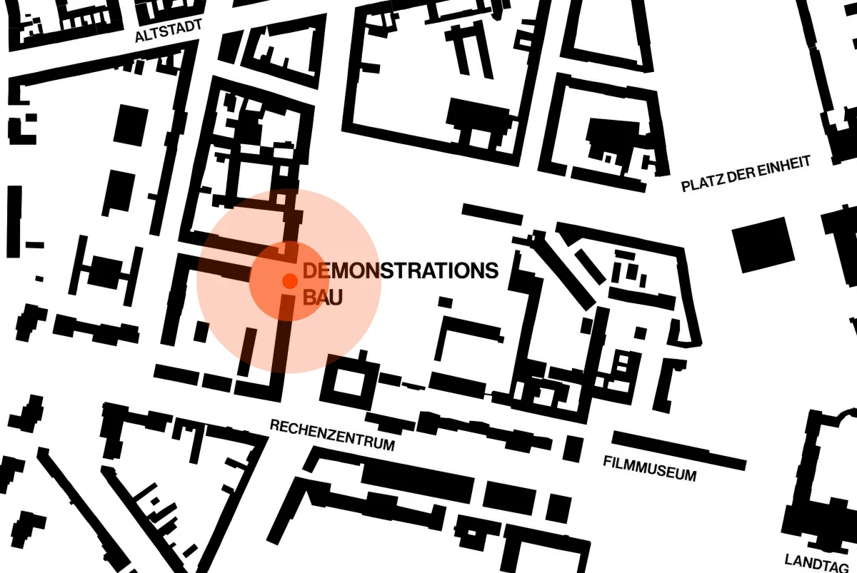 Black-and-white map of Potsdam with an orange marker highlighting the demonstration building.