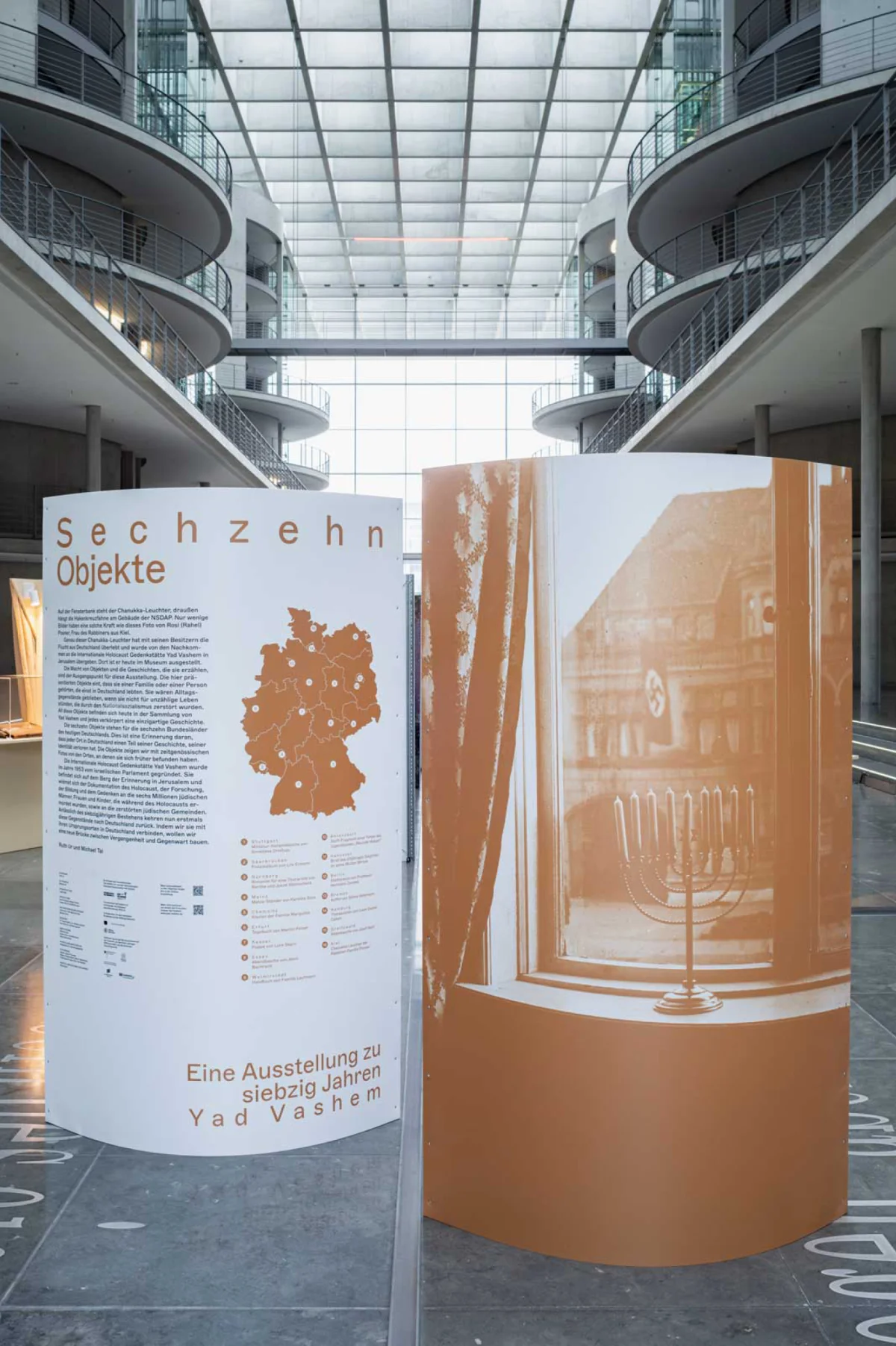 Entrance module for “Sixteen Objects”, with a map of Germany and a large historical window photograph.